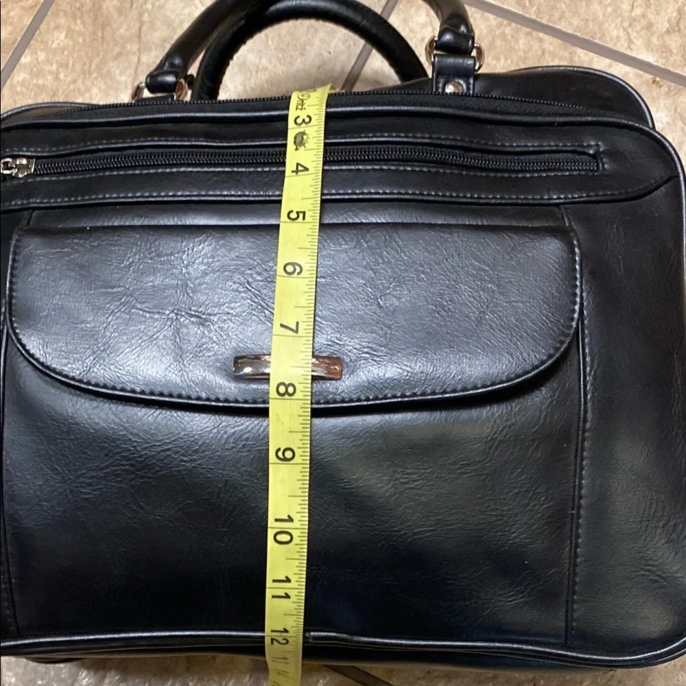 Black Duffel Bag with Structured Design and Smooth Vinyl Practical Utility